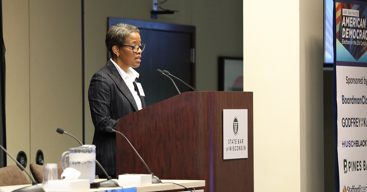 a woman speaking at a podium