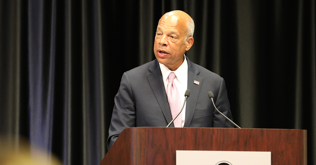 a man speaking at a podium