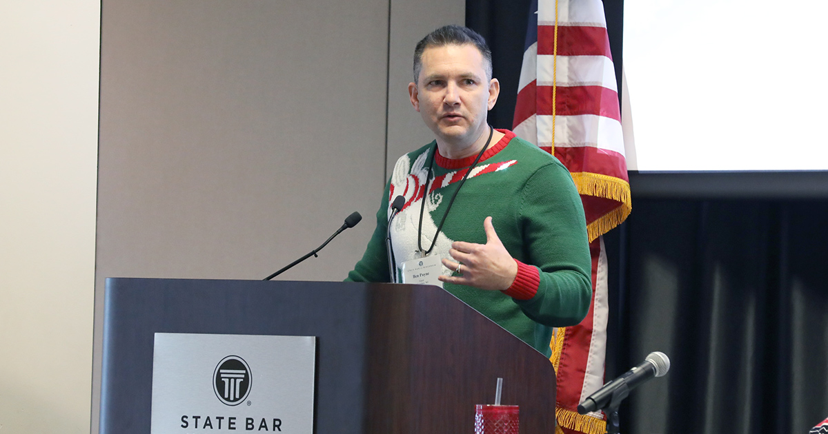 a man speaking at a podium