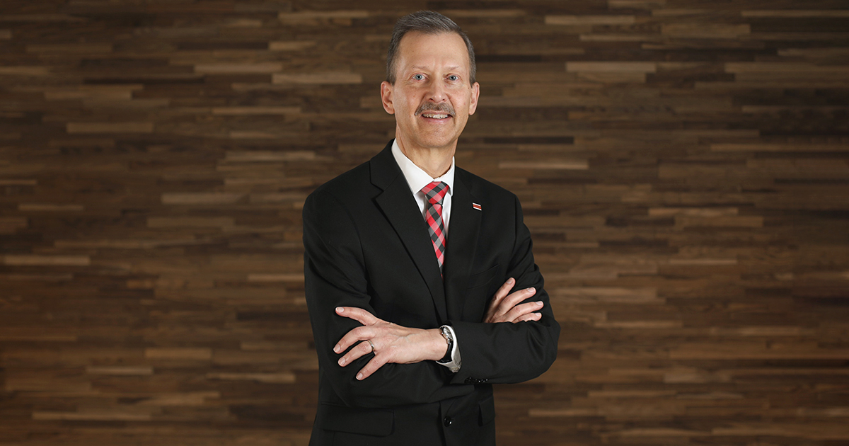 Judge James Babler stands and smiles at the camera