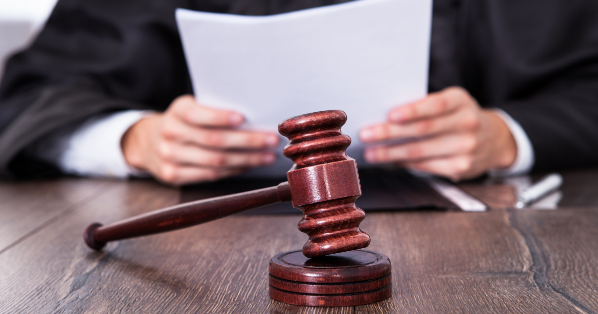 Black Robed Judge Holding a Piece of Paper