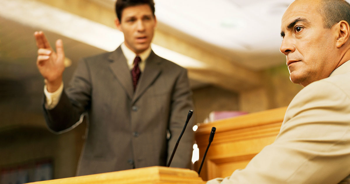attorney asks expert witness a question at trial
