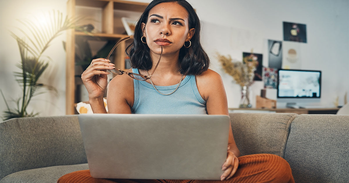 Person thinking with laptop