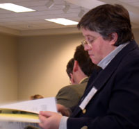 Photo: Gov. Deborah M. Smith reviews materials at board meeting.